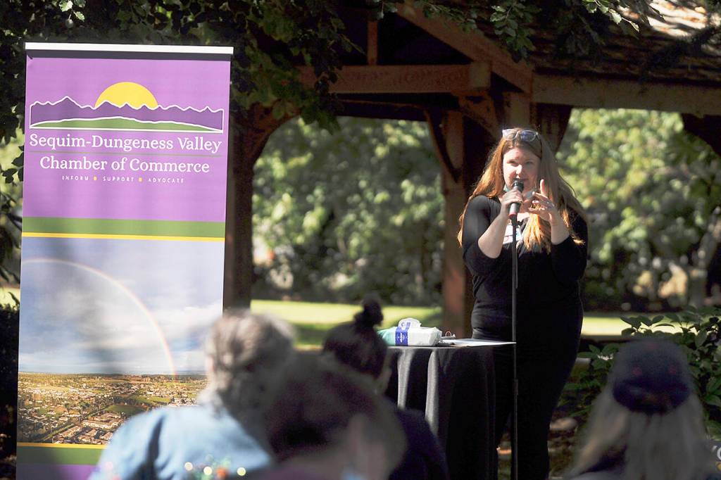 Anji Scalf, executive director of the Sequim-Dungeness Chamber of Commerce, speaks at a chamber luncheon honoring first responders and other recipients of the chambers annual Citizen of the Year award, held on Aug. 24. Scalf announced she is resigning her position effective Oct. 12. Sequim Gazette file photo by Michael Dashiell