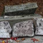 Pieces of headstones which were once scattered around Pioneer Memorial Park in Sequim before being gathered into a memorial corner which was vandalized between the 1960s and 80s wait to be pieced together by volunteers from the community, the Sequim Prairie Garden Club and the Michael Trebert Chapter of the Daughters of the American Revolution. The preservationists requested that any pieces of headstones that are in the possession of the community be returned so that the stones can be restored completely. Sequim Gazette photo by Emily Matthiessen