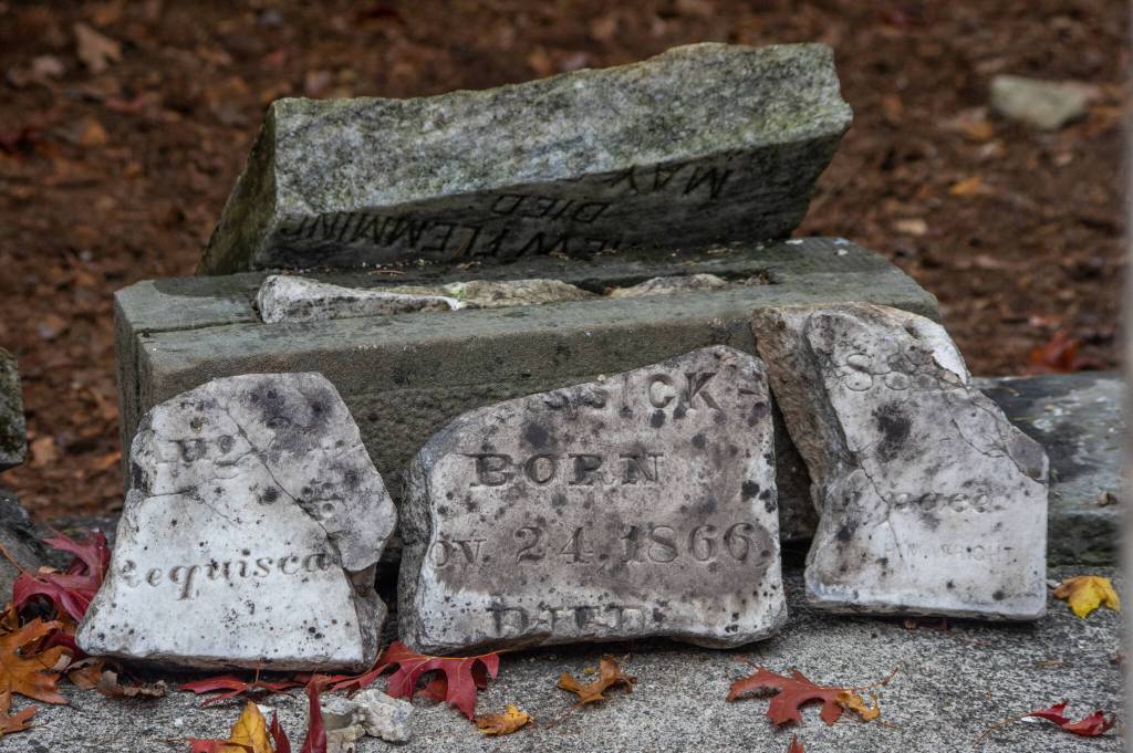 Pieces of headstones which were once scattered around Pioneer Memorial Park in Sequim before being gathered into a memorial corner which was vandalized between the 1960s and 80s wait to be pieced together by volunteers from the community, the Sequim Prairie Garden Club and the Michael Trebert Chapter of the Daughters of the American Revolution. The preservationists requested that any pieces of headstones that are in the possession of the community be returned so that the stones can be restored completely. Sequim Gazette photo by Emily Matthiessen