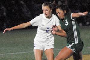 Keith Thorpe/Peninsula Daily News
Sequim's Mikiah Winter, left, battles for control with Port Angeles' Piper Williams on Tuesday in Port Angeles.