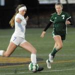 Keith Thorpe/Peninsula Daily News
Sequim's Bailey Genessie, left, tries to out pace Port Angeles' Izzy Felton during Tuesday's match at Peninsula College in Port Angeles.