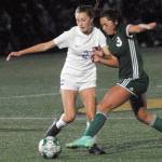 Keith Thorpe/Peninsula Daily News
Sequim's Mikiah Winter, left, battles for control with Port Angeles' Piper Williams on Tuesday in Port Angeles.