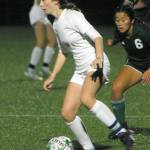 Keith Thorpe/Peninsula Daily News
Sequim's Rileigh Van Dyken, left, works her way past Port Angeles' Lily Sanders on Friday in Port Angeles.