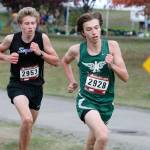 Port Angeles Max Baeder, right, edges Sequims Colby Ellefson for medalist honors at an Olympic League meet on oct. 13 at Bainbridge Islands Battle Point Park. Photo by Mark Krulish/Kitsap News Group
