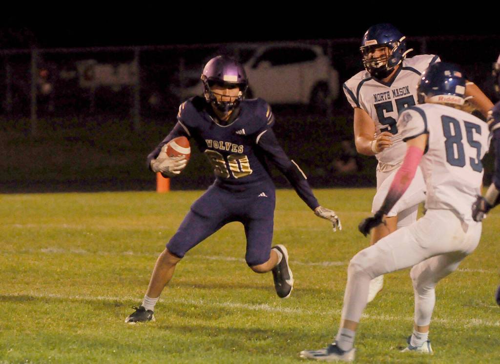 Sequim receiver Isaiah Moore breaks into the yardage after a catch in the first half of Sequims 29-28 win over North Mason on Oct. 16. Applegate led the team with 84 receiving yards. Sequim Gazette photo by Michael Dashiell