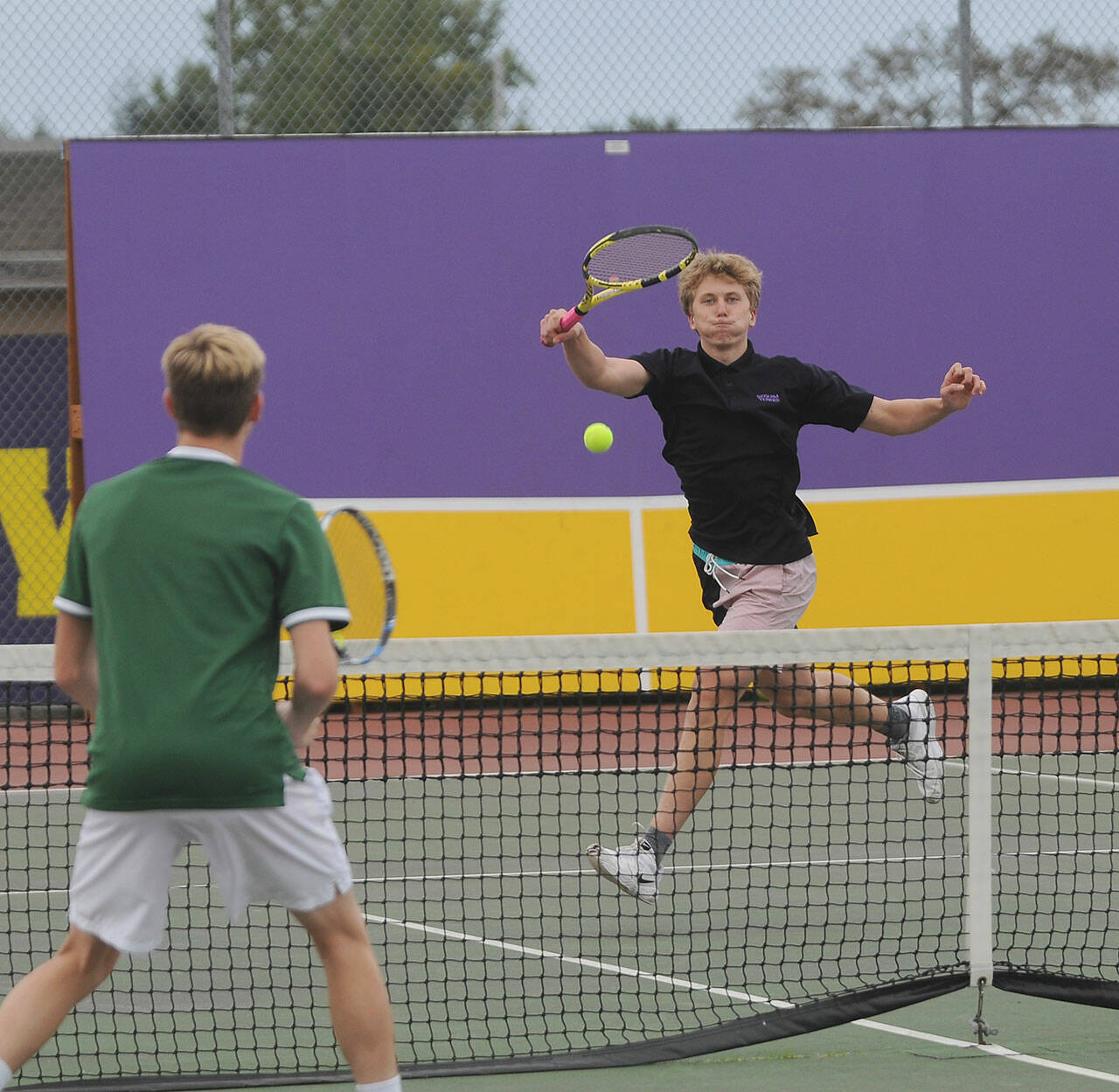 Sequims Jack Van De Wege, right, returns a shot in a No. 1 doubles match as he and partner Henry Hughes take on Port Angeles on Oct. 14. Sequim Gazette photo by Michael Dashiell