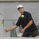 Sequims Henry Hughes returns a shot in a No. 1 doubles match as he and partner Jack Van De Wege take on Port Angeles on Oct. 14. Sequim Gazette photo by Michael Dashiell