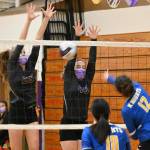Sequims Jolene Vaara, left, and Malory Morey look to block a hit by Bremertons Madison Gardner in the second game of SHSs three-game sweep of the visiting Knights on Oct. 19. Sequim Gazette photo by Michael Dashiell