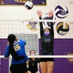 As teammate Allie Gale, center, looks on, Sequims Angel Wagner looks to put a block on Bremertons Kamari Joiner in the second game of SHSs three-game sweep of the visiting Knights on Oct. 19. Sequim Gazette photo by Michael Dashiell