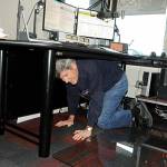Bud Davies drops and covers during the Great Washington Shakeout drill on Oct. 21. He and about a dozen KSQM volunteers sent the test drill to the airwaves and did a drill themselves to prepare for a potential earthquake or tsunami.