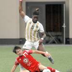 Peninsulas Dylan Pauw, top, gets cut off by Skagit Valleys Hayato Morimoto during an Oct. 20 match in Port Angeles. Photo by Keith Thorpe/Olympic Peninsula News Group
