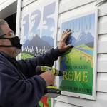 Outside the float barn, Guy Horton hangs up this years royalty floats sign. I thought this year was an amazing float, he said. It was his 14th and final float, he said as he plans to focus more on work and family- and self-care. Sequim Gazette photo by Matthew Nash