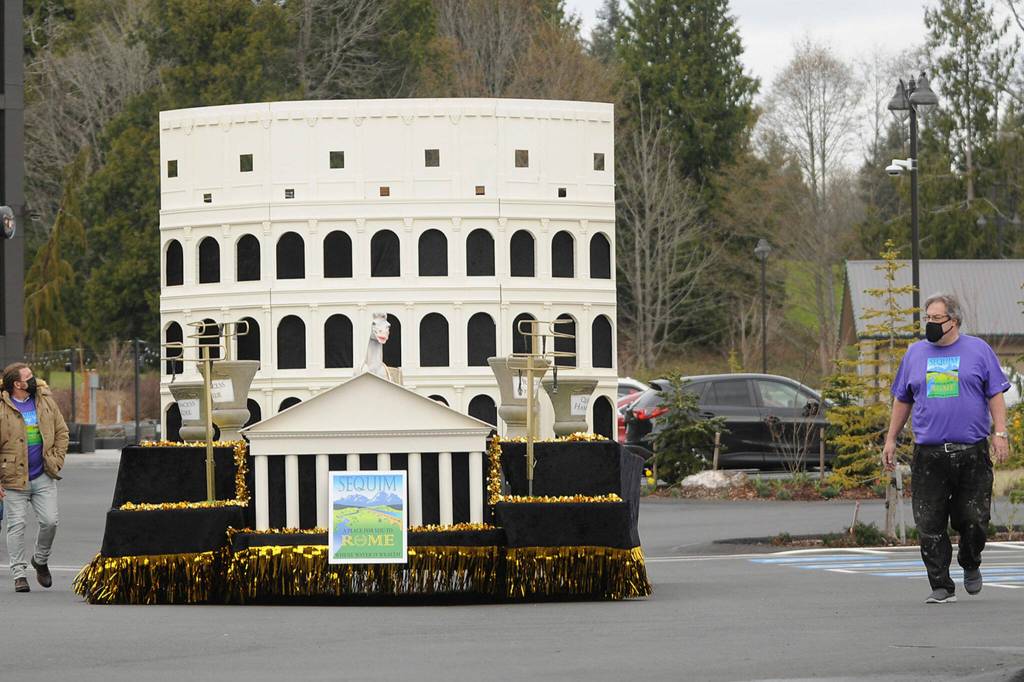 Guy Horton, on right, walks with this years Sequim Irrigation Festival float. I thought this year was an amazing float, he said. It was his 14th and final float, he said as he plans to focus more on work and family- and self-care. Sequim Gazette file photo by Michael Dashiell
