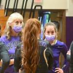 With players donning masks during matches during the 2021 season, SHS head coach Jennie Webber Heilman talks with them during a timeout. Sequim Gazette file photo by Michael Dashiell