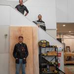 Four of the six member team of Camp N Car pose on the stairs to the office of their shop in Port Townsend. Sequim Gazette photo by Emily Matthiessen