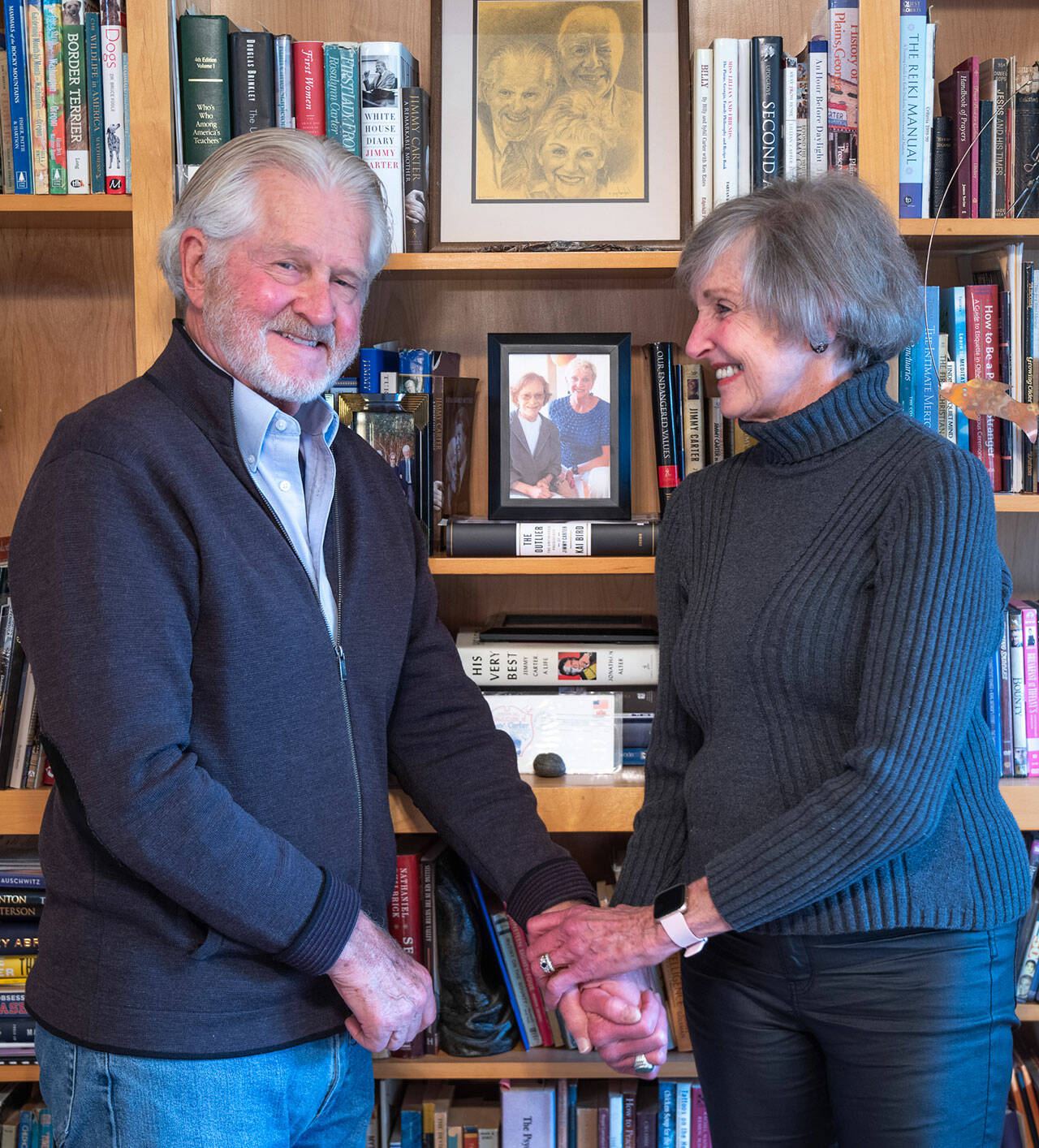 Jim Dries and Carol Swarbrick Dries stand before a bookshelf of Carter memorabilia and books in Sequim. The husband/wife team wrote a two-act one-woman play about Lillian Carter, President Carters remarkable mother which has evolved into a docudrama released this year, directed by Vivian Winther, with the blessing of the former President. Interviews with Tommy LaSorda, Sam Donaldson, President Carter and Rosalyn Carter are complemented by performances by Swarbrick Dries filmed in Plains, Georgia, the Presidents birthplace and hub of humanitarian activity. Sequim Gazette photo by Emily Matthiessen