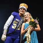 Sequim Highs Homecoming King and Queen, Pryce Glasser and Alex Schmadeke, smile for the crowd at the Homecoming game halftime festivities on Oct. 15. Sequim Gazette photo by Michael Dashiell