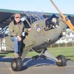 Sequim pilot and veteran David Woodcock stands near his 1944 Piper Cub L-4H, an aircraft that saw action at the Battle of the Bulge. Sequim Gazette photo by Michael Dashiell