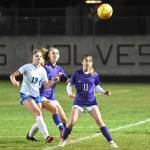 As teammate Hannah Wagner, second from left, looks on, Sequims Alliyah Weber keeps her eye on a bounding ball in the first half of an Oct. 27 game against North Mason. Sequim Gazette photo by Michael Dashiell
