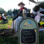 Bob Clark helps hand out candy at the Sequim Prairie Granges drive-through event Oct. 30 while roasting up a morbid meal. See more Halloween photos, A-8. Sequim Gazette photo by Matthew Nash