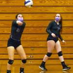 As teammate Kelsi Bergeson looks on, Sequims Allie Gale bumps a pass in the Wolves 3-1 win over Kingston on Nov. 2. With the win, Sequim advanced to the Olympic League seeding tourney final against North Kitsap. Sequim Gazette photo by Emily Matthiessen