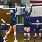 Above: With Sequims Kendall Hastings (second from left) and Malory Morey up at the net for a block, teammate Allie Gale looks to volley this Kingston hit in the Wolves 3-1 win over the visiting Buccaneers Nov. 2. Right: Sequims Kendall Hastings, center, looks to put a spike past the block attempts of Kingstons Marion Stejer (11) and Eva Stejer (2) Sequim Gazette photos by Emily Matthiessen