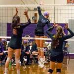 Sequims Kendall Hastings, center, looks to put a spike past the block attempts of Kingstons Marion Stejer (11) and Eva Stejer (2) in the Wolves 3-1 win over Kingston on Nov. 2. Sequim Gazette photo by Emily Matthiessen