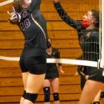 Sequims Malory Morey, left, blocks a Kingston spike attempt on Nov. 2. Sequims Wolves topped the Buccaneers 3-1 in the Olympic League seeding tournament semifinal. Sequim Gazette photo by Emily Matthiessen