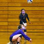 As teammate Allie Gale looks on, Sequims Jordan Hegtvedt gets down low for a volley in the Wolves 3-1 win over Kingston on Nov. 2. Sequim Gazette photo by Emily Matthiessen