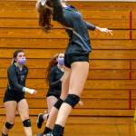 As teammates Allie Gale, left, and Kelsi Bergeson look on, Sequims Jolene Vaara rises up for a hit in the Wolves 3-1 win over Kingston on Nov. 2. Sequim Gazette photo by Emily Matthiessen