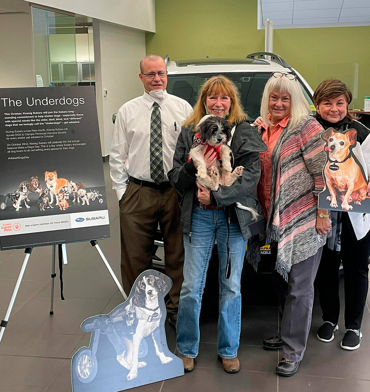 From left: Ken Cardella, Patty Mendenwald and Nadean Portner of Koenig Subaru celebrate the business third Make a Dogs Day with Luann Hinkle, executive director at Olympic Peninsula Humane Society. Submitted photo