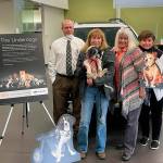 From left: Ken Cardella, Patty Mendenwald and Nadean Portner of Koenig Subaru celebrate the business third Make a Dogs Day with Luann Hinkle, executive director at Olympic Peninsula Humane Society. Submitted photo
