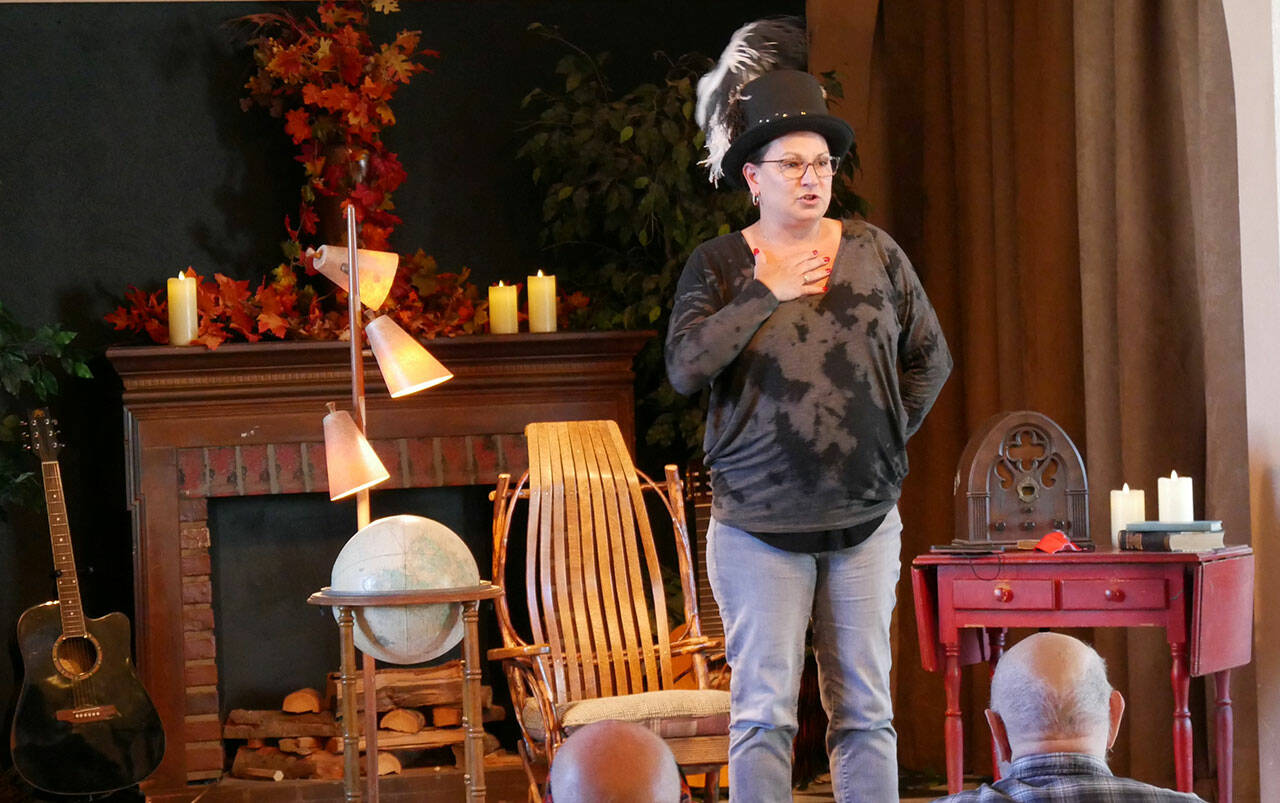 Story Slam organizer Jeanné Sparks tells a story at Olympic Theatre Arts Centers recent Tale Spinners event. Photo courtesy of Olympic Theatre Arts Center