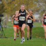 Sequim High senior Riley Pyeatt keeps pace with the lead pack in the opening mile of the class 2A state cross country championship meet in Pasco on Nov. 6. Pyeatt earned her second top-10 finish of her prep career, placing fifth overall. Sequim Gazette photos by Michael Dashiell