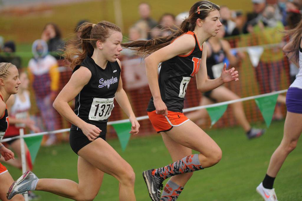 Sequims Riley Pyeatt makes her way of the first hill at the state of the 2A state cross country meet in Pasco on Nov. 6. Pyeatt finished fifth, earning her third top-15 finish at state in three chances. Sequim Gazette photo by Michael Dashiell