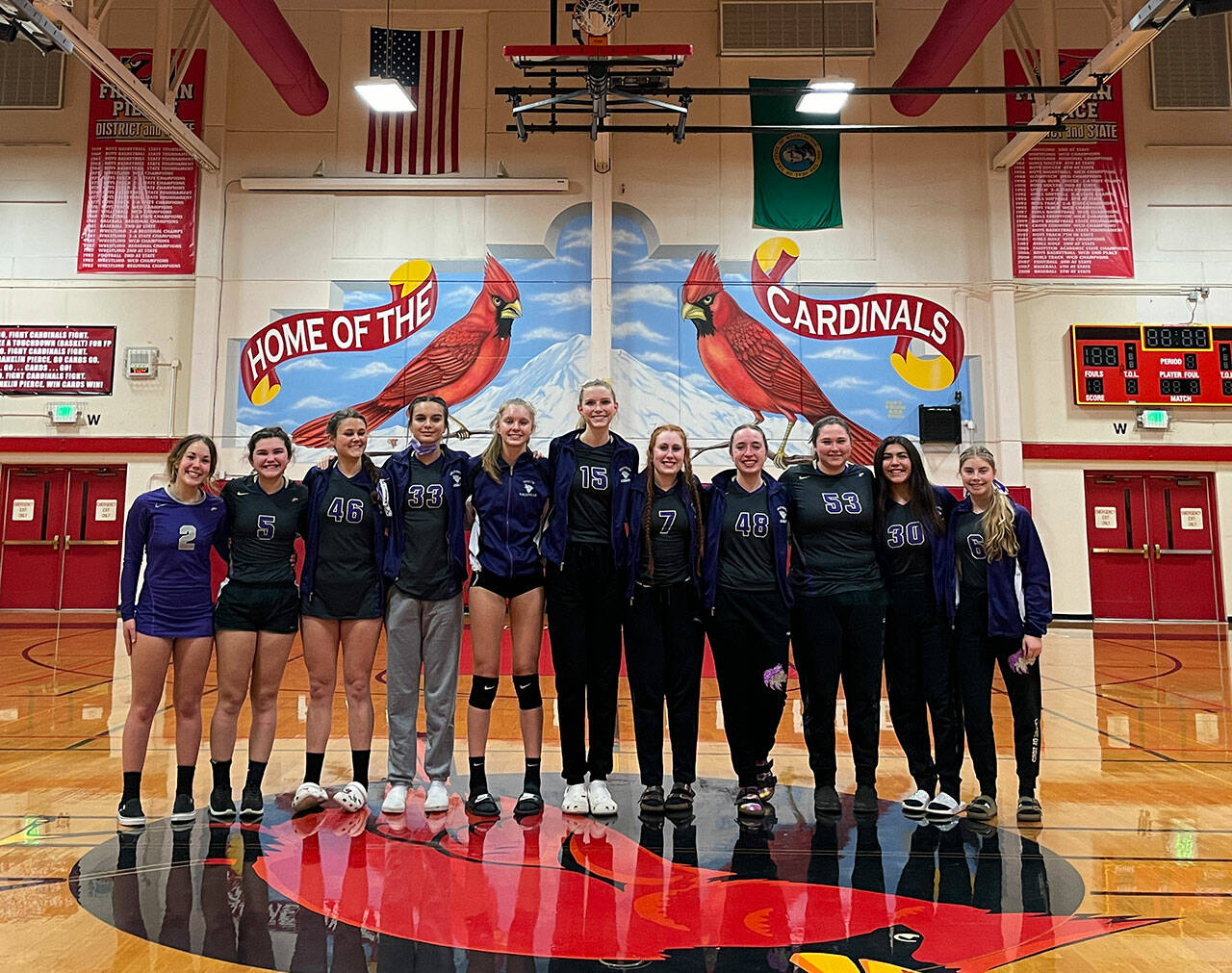 Sequim High Schools volleyball squad celebrates a win over Kingston in the West Central District tourney on Nov. 10 at Franklin Pierce High School in Tacoma. The Wolves went on to beat Olympic to earn a spot at the 2A state tournament in Yakima set for Nov. 19-20. Pictured, from left, are Jordan Hegtvedt, Allie Gale, Angel Wagner, Arianna Stoval, Jolene Vaara, Kendall Hastings, Kelsi Bergeson, Malory Morey, Sammie Bacon, Kaila Spaulding and Mia Coudriet. Photo by Wendy Morey