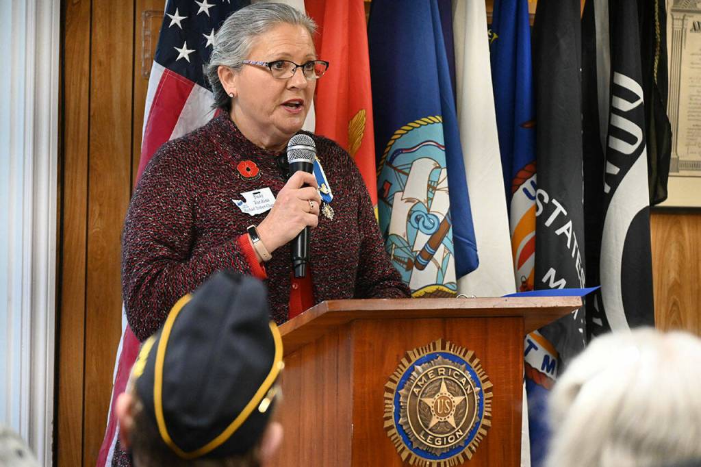 Judy Tordini, representing the Michael Trebert Chapter of the Daughters of the American Revolution, leads a recognition of the 100th anniversary of the Tomb of the Unknown Soldier, at last weeks Veterans Day ceremony at American Legion Jack Grennan Post No. 26. Sequim Gazette photo by Michael Dashiell