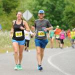 Alicia and Korey Konga of Yelm race down Whitefeather Way during the 2017 North Olympic Discovery Marathon. Sequim Gazette file photo by Michael Dashiell
