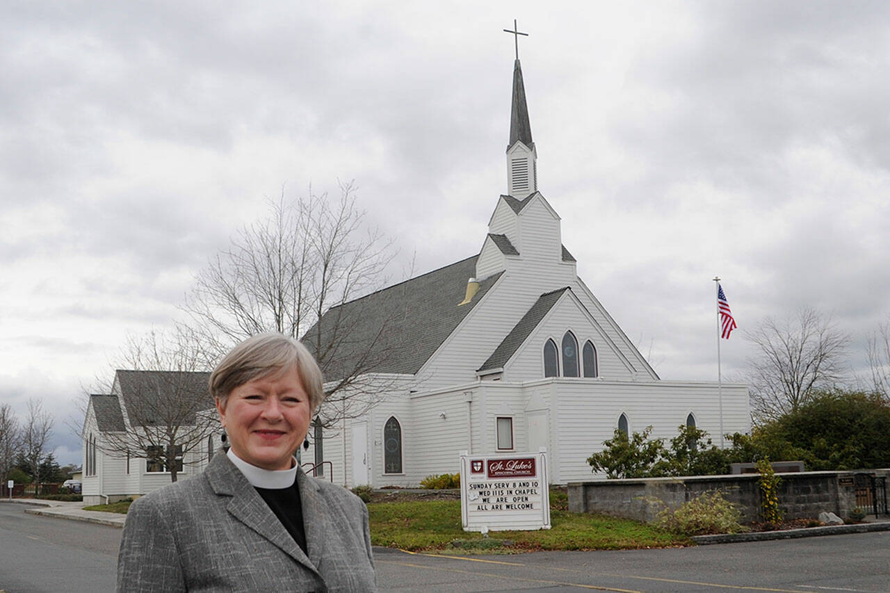 Rev. ClayOla Gitane, rector at St. Lukes Episcopal Church in Sequim, plans to start a new sound system through the churchs bell tower playing the Westminster Chime and hymns at noon on Thanksgiving. From then, the bell will ring every quarter hour and on the hour, from 8 a.m.-8 p.m. daily, and at noon theyll play a selected hymn. Sequim Gazette photo by Matthew Nash