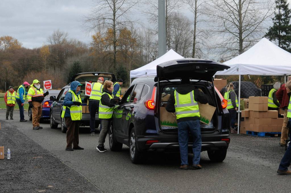 For the Family Holiday Meal Bag program on Nov. 19, about 715 boxes went to local families for Thanksgiving, including 650 at Carrie Blake Community Park and 65 from home deliveries. Sequim Gazette photo by Matthew Nash