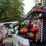 Diamond Point residents Kent Bohac, left, and Craig Tenhoff ready candy canes and ornaments for trees along Diamond Point Road. Sequim Gazette photos by Matthew Nash