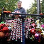 Craig Tenhoff readies to hand off candy canes to place along Diamond Point Road last Saturday. Sequim Gazette photo by Matthew Nash