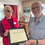 World War II veteran John A. Katte, 95, of Sequim, receives a commemorative National Society of the Daughters of the American Revolution thank you for your service certificate from Melody Albertson, Michael Trebert Chapter Chair of National Defense. Submitted photo