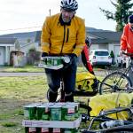 Steve Resnick of Sequim is the first rider back at the 2021 Sequim Cranksgiving booth. His team of 3 Crabs are riders gathered the most of participating teams, with 1,723 pounds collected. Sequim Gazette photo by Michael Dashiell