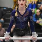 Sequim Highs Danica Pierson competes in the bars event at the class 1A/2A/3A state meet in Bellevue as a freshman in February 2019. She returns along with five other Wolves to compete with a combined group including Port Angeles and Crescent athletes during the 2021-2022 regular season. Photo by Kevin Hanson/Enumclaw Courier-Herald