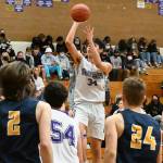 Sequims Isaiah Moore shoots a jumper over the Forks defense in a 65-45 win over the visiting Spartans on Dec. 3. 
Sequim Gazette photo by Michael Dashiell
