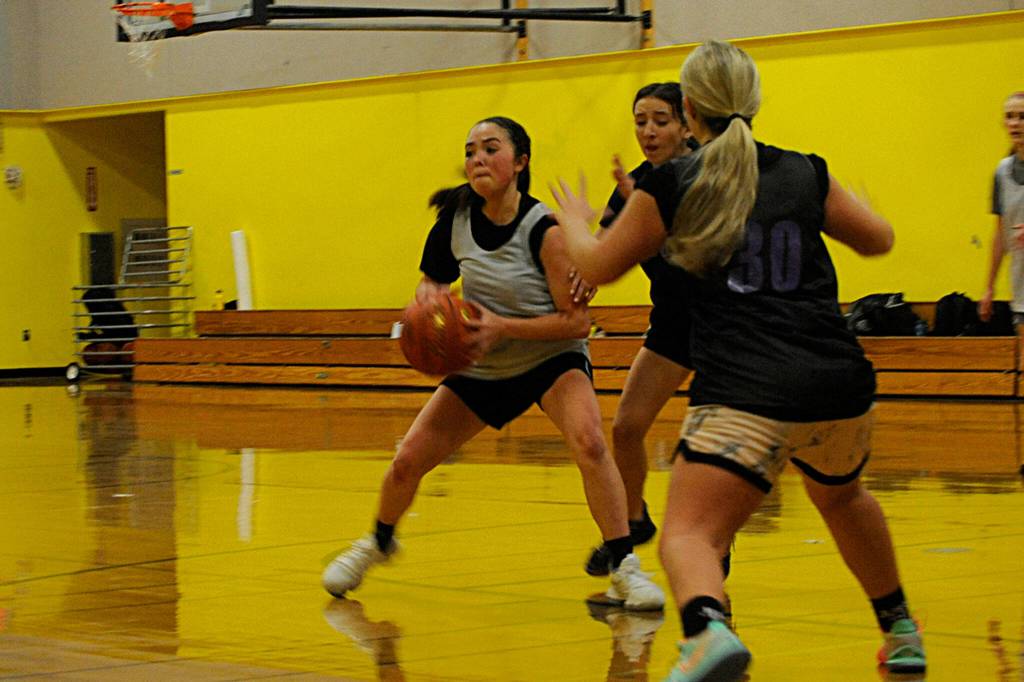Hannah Bates looks to pass as she and teammates prep for the oncoming season. We all get along and learn from each other, she said. We definitely feed off each other. Sequim Gazette photo by Matthew Nash