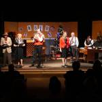 The cast of A Christmas Carol: A Live Radio Play perform on preview night.