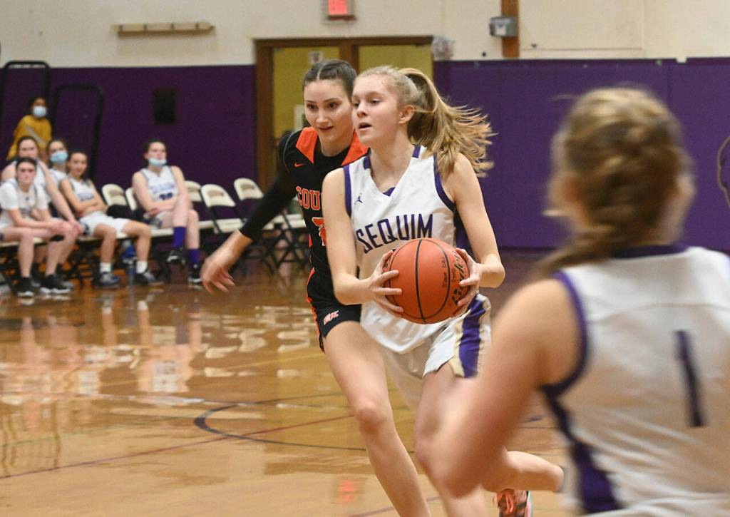 Sequims Jolene Vaara looks for an open teammate in the Wolves Dec. 13 match-up with Central Kitsap. Sequim Gazette photo by Michael Dashiell