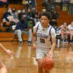 Sequims Bobbie Mixon looks to pass in the Wolves Dec. 13 home match-up with Central Kitsap. The visiting Cougars edged Sequim, 44-42. Sequim Gazette photo by Michael Dashiell